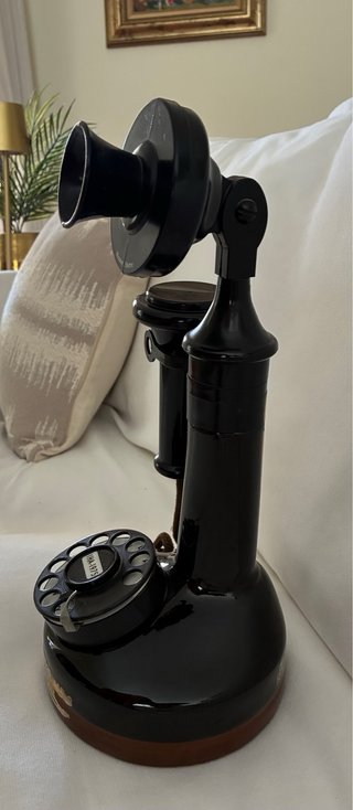 Teléfono antiguo botella negro