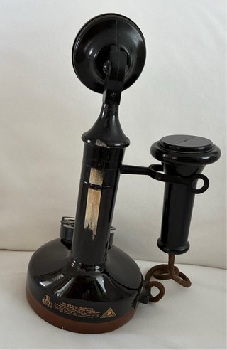 Teléfono antiguo botella negro
