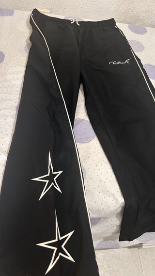 Pantalones anchos chándal con raya lateral