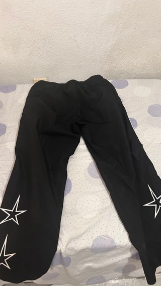 Pantalones anchos chándal con raya lateral