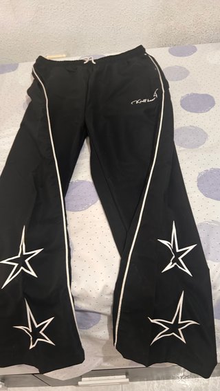Pantalones anchos chándal con raya lateral