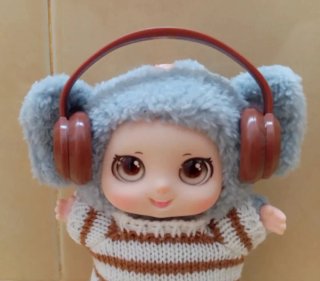 Muñeca Bebé Elefante con jersey y Auriculares