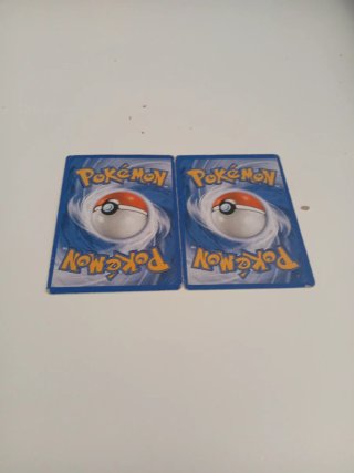 Pikachu 35/108 y Charmander 9/108