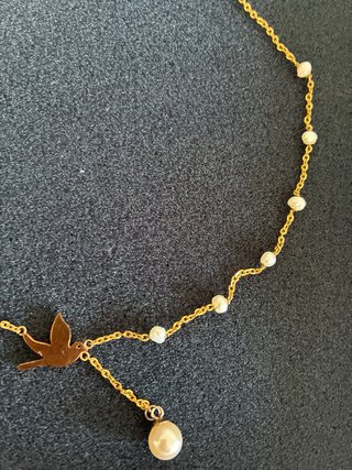 Colgante pájaro perlas oro hecho a mano