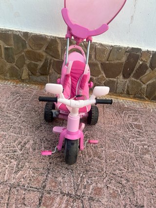 Triciclo Juguettos rosa con capota