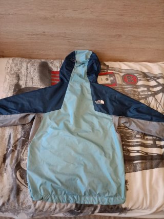 Cortavientos The North Face azul y gris