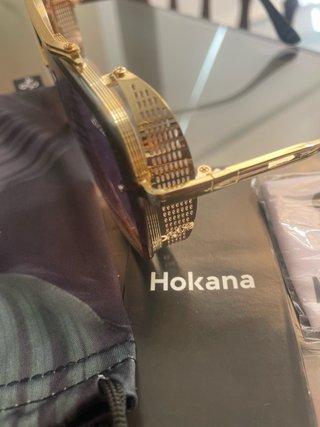 Gafas de sol Hokana doradas con cristales azulados