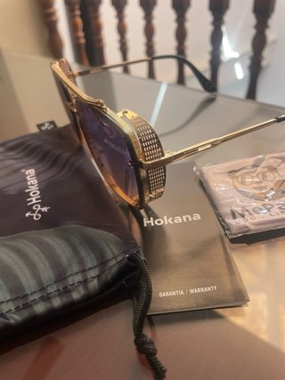 Gafas de sol Hokana doradas con cristales azulados