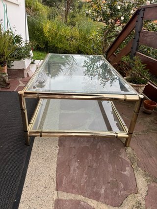 Mesa centro cristal y metal dorado