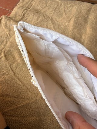 Bolso de mano tejido con lazo