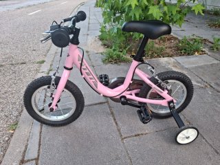 Bicicleta infantil 12" rosa con ruedines