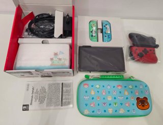 Nintendo Switch OLED Blanca con varios accesorios