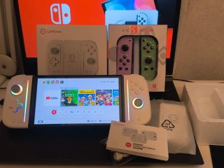 Nintendo Switch OLED + 3 Juegos + Joy pad controll
