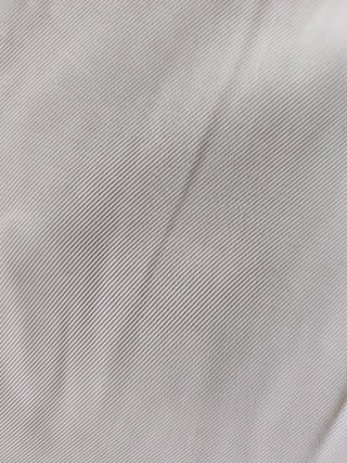 Pantalón traje cintura despuntada beige