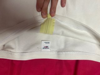 Top Reebok blanco con cremallera