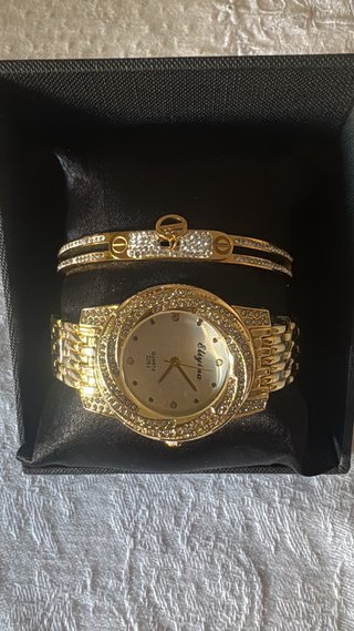 Reloj y pulsera dorados Elygina