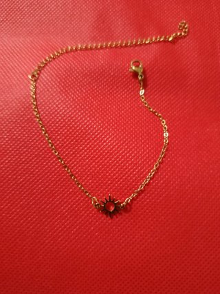 Pulsera dorada con sol