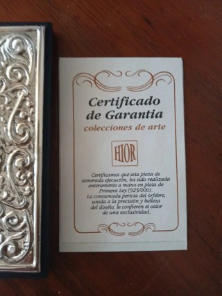 Agenda telefónica de plata con certificado