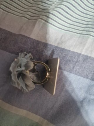 Supporto telefono fiore azzurro