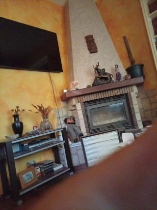 Estufa de leña integrada en chimenea