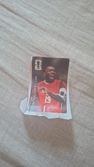 Figurina Coca Cola Alphonso Davies Mondiali