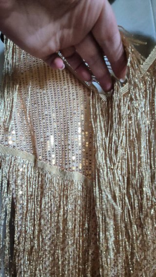 Top oro con frange e paillettes