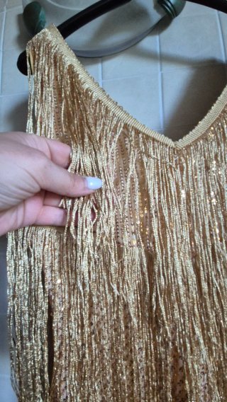 Top oro con frange e paillettes