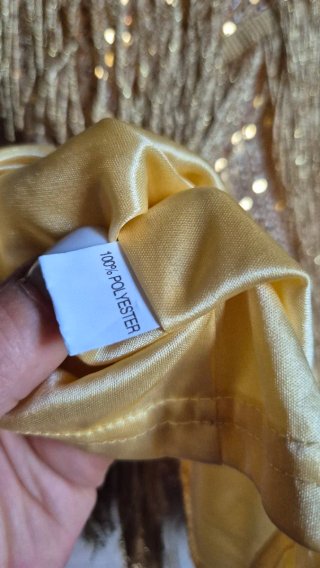 Top oro con frange e paillettes