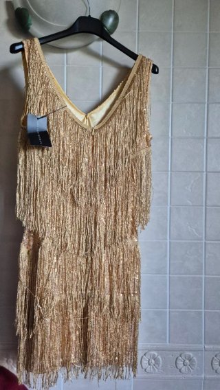 Top oro con frange e paillettes