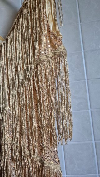 Top oro con frange e paillettes