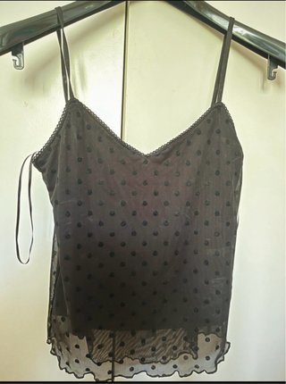 Blusa negra de topos