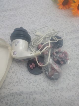 Masajeador eléctrico con accesorios