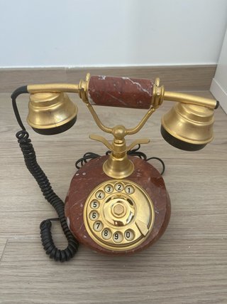 Teléfono antiguo de mármol y oro