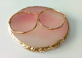 Pendientes Unode50 dorados retorcidos