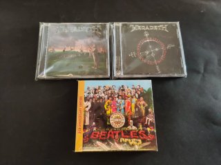 Megadeth y The Beatles CDs