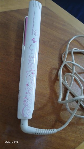Plancha de pelo ghd rosa y blanca