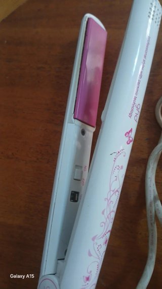 Plancha de pelo ghd rosa y blanca