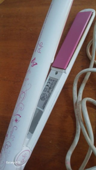 Plancha de pelo ghd rosa y blanca