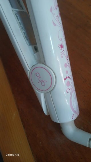 Plancha de pelo ghd rosa y blanca