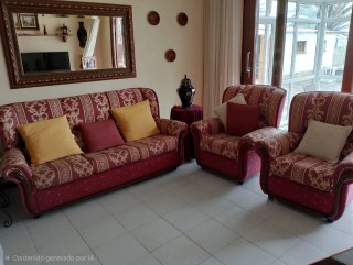 Sofá y sillones de tela con detalles