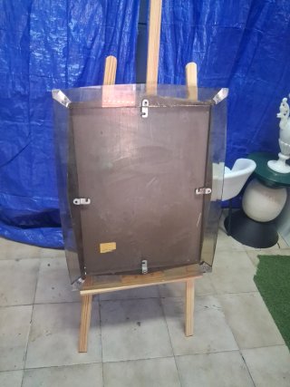 Espejo decorativo con marco plateado