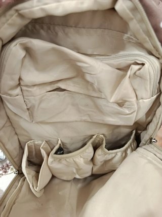 Mochila beige con lunares