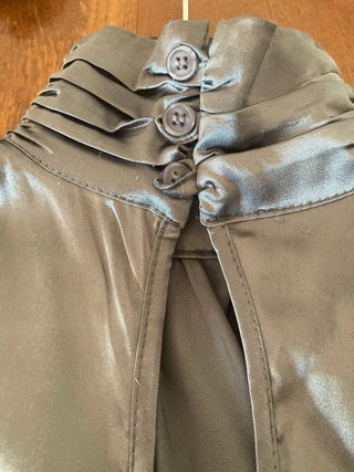Top collo alto grigio senza maniche