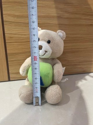 Peluche oso con cubo verde