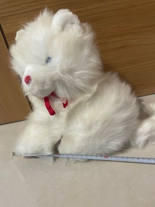 Peluche blanco con lazo rojo