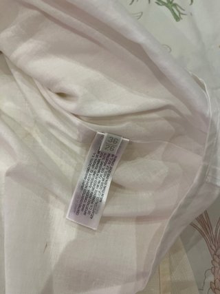 Falda blanca plisada con cinturón