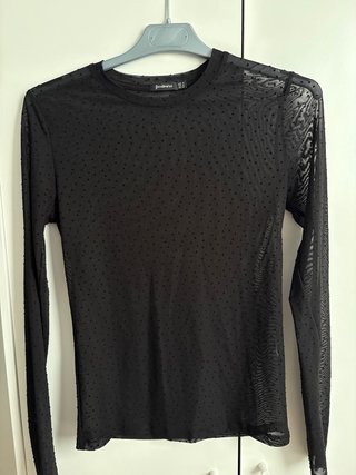 Blusa Stradivarius negra transparente puntos