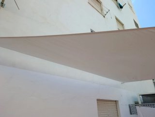 Toldo Vela Triangular crema