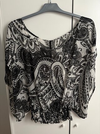 Blusa vaporosa transparente con cintura elástica