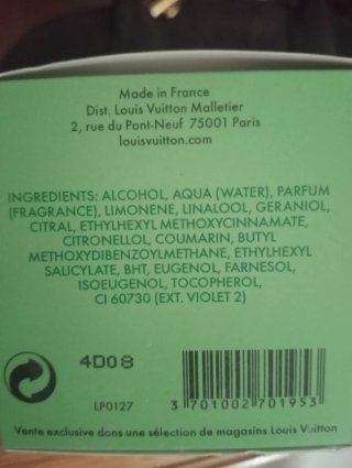 Perfume verde y blanco
